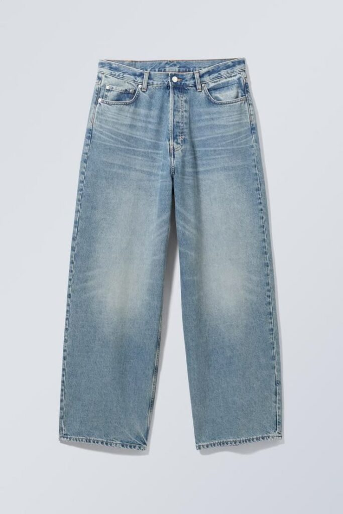 Astro loose baggy leg jeans, light blue denim, relaxed fit, modern urban streetwear.